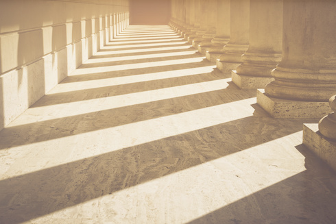 Photo of shadowed columns on a building